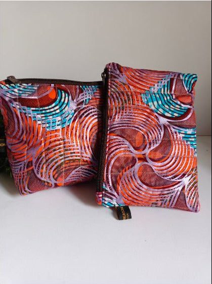 Trousse matelassée en wax et imperméable colorée