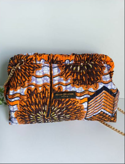 Pochette Ganni en wax matelassée